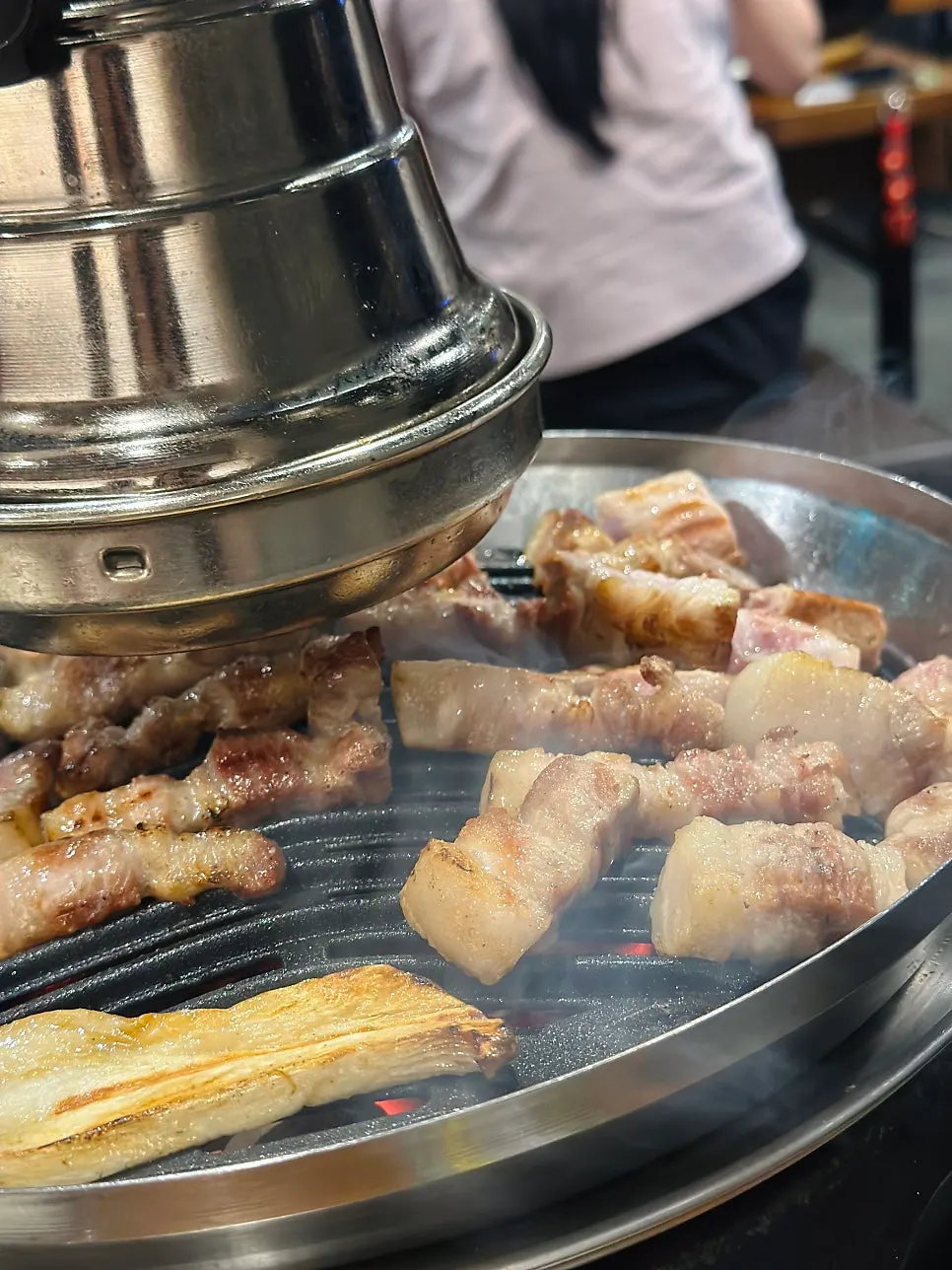 Meat cooking to a golden brown on the grill