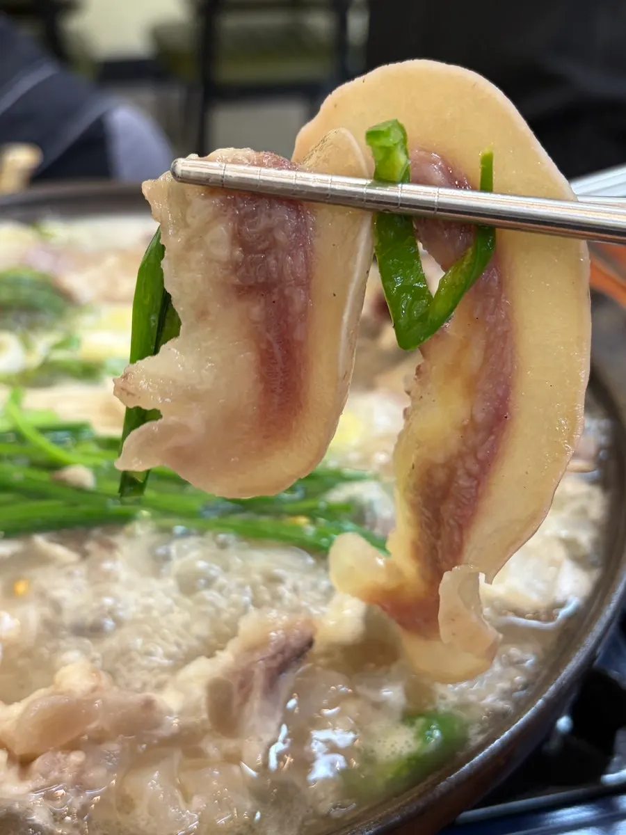 A piece of beef head meat dipped in sauce