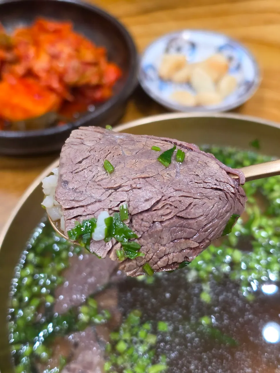 Meat and minari in the minari gomtang special