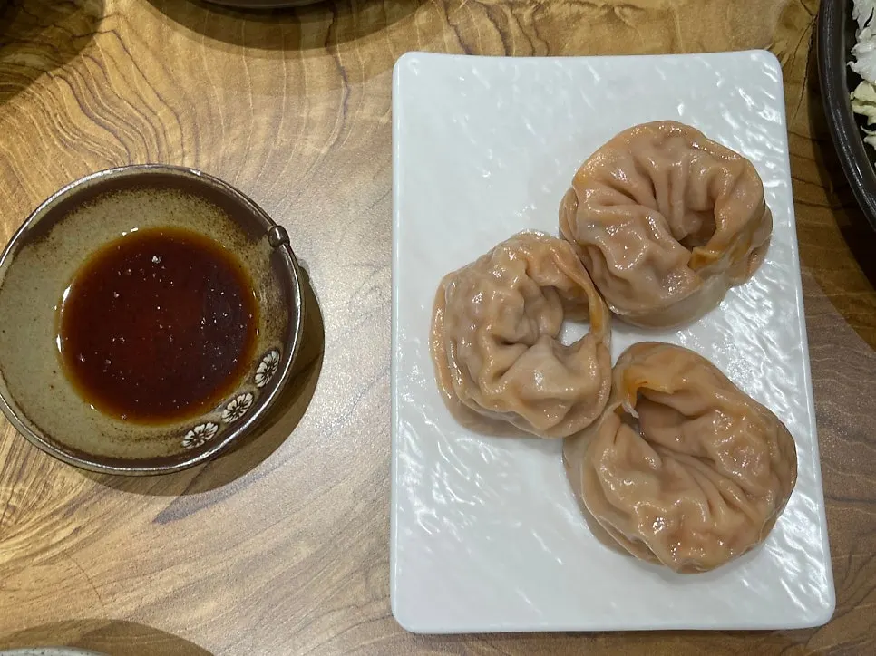 Three kimchi dumplings with thin skins