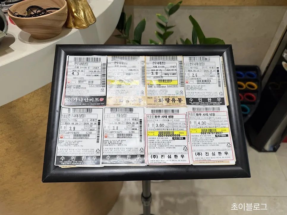 Sign about using only top-grade Hanwoo beef with beef labels on display