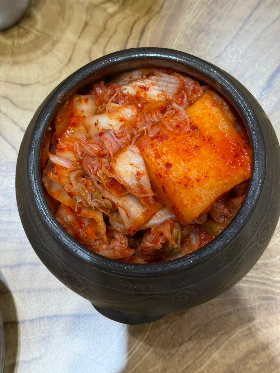 Jars of kimchi and radish kimchi placed on the table