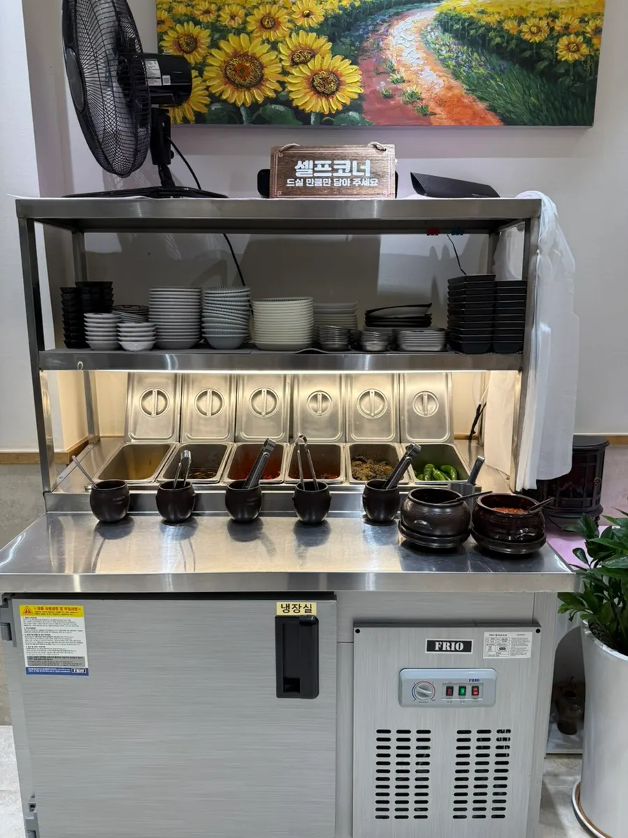Self-serve bar fully stocked with side dishes