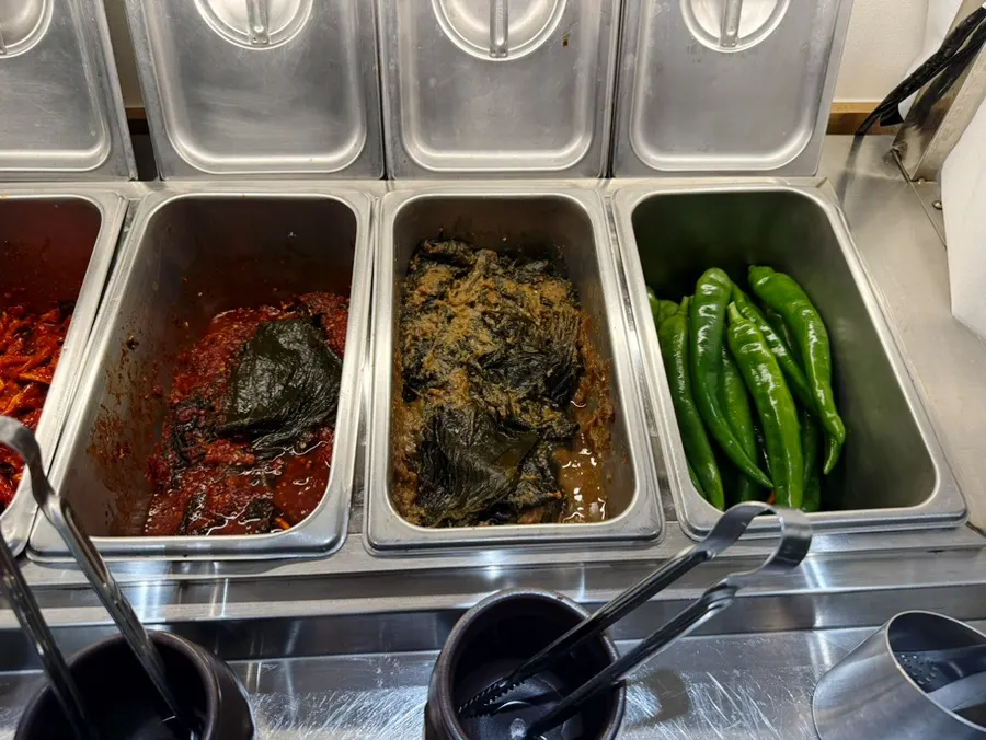 Self-serve bar with dried radish and garlic-chili pickles