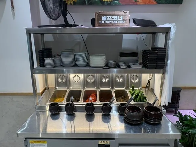 Self-serve corner stocked with side dishes