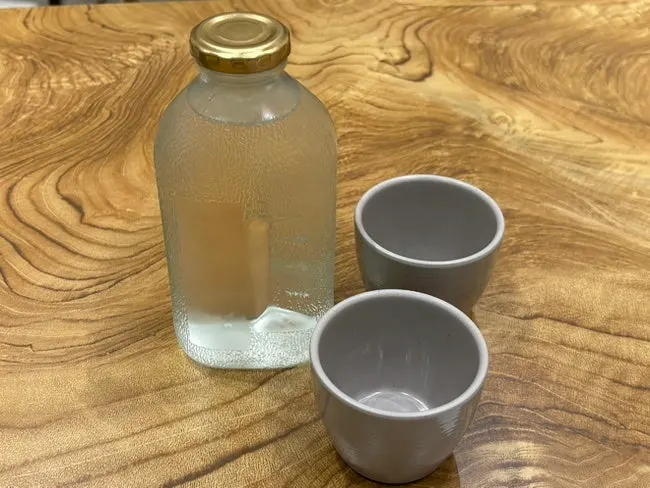 Water in a glass bottle and table setting