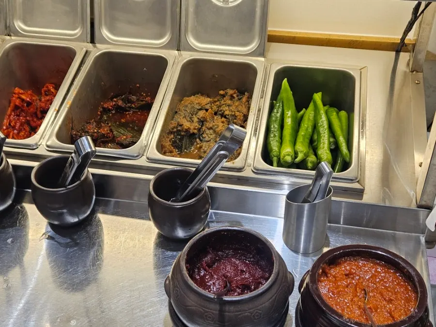 Self-serve bar with soybean paste sesame leaf pickle and cucumber peppers