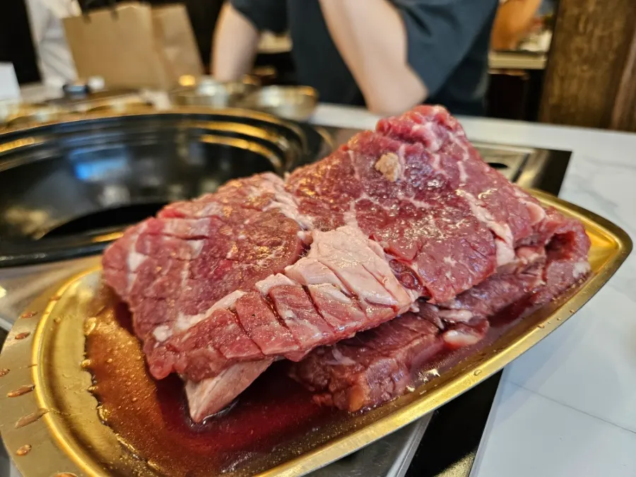 Raw marinated beef king galbi for two on a plate