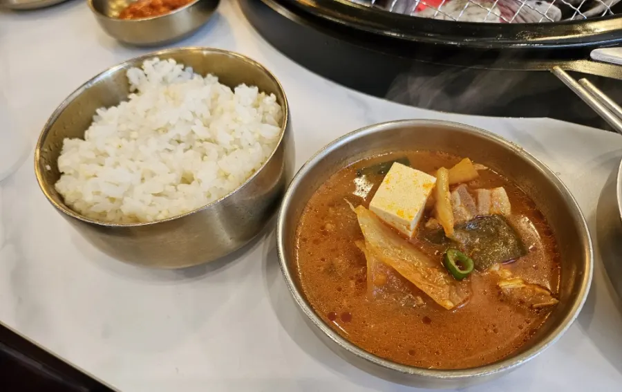 Pork kimchi jjigae served in a stone pot