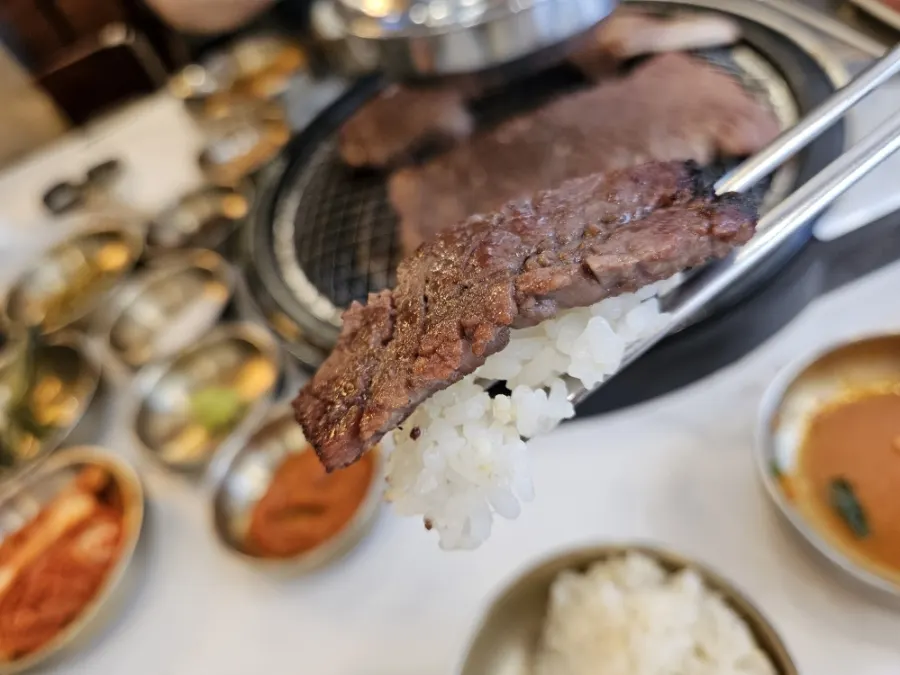 A grilled piece of marinated beef galbi