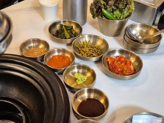 Basic table setting of side dishes and sauces at Geumseong Hoegwan