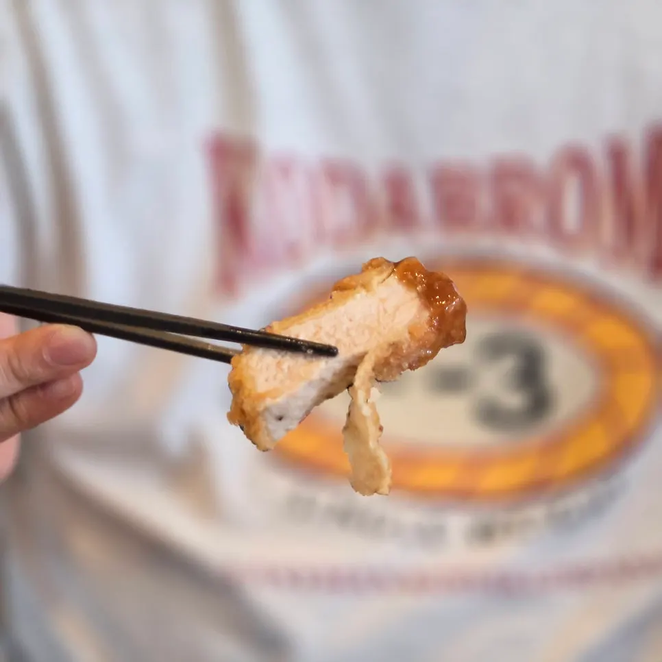 A piece of sirloin katsu with visible fat marbling