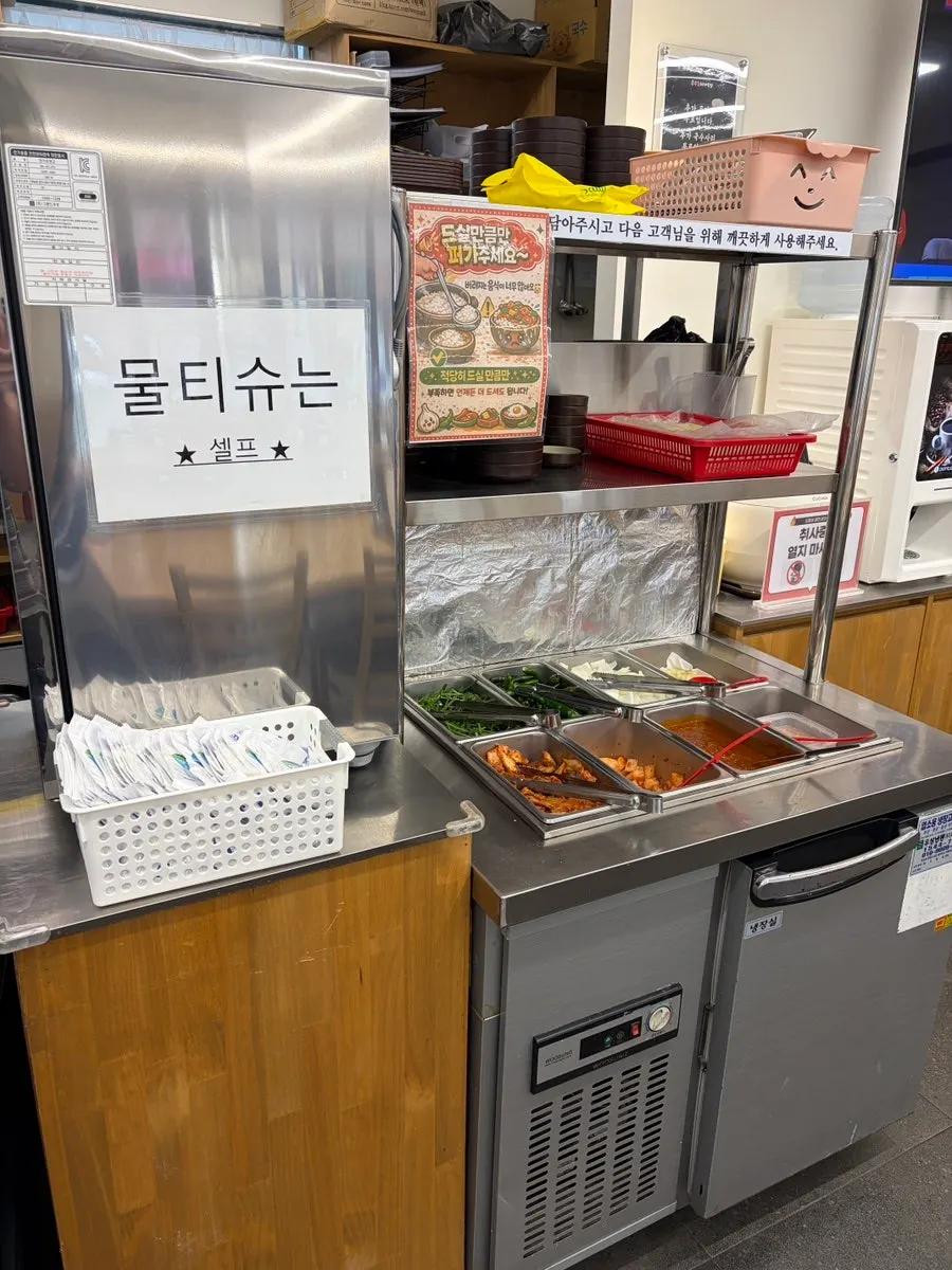 Side dishes and thin noodles at the self-serve bar