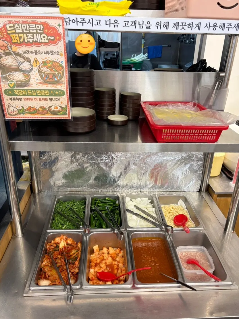 Self-serve bar with unlimited rice refill sign