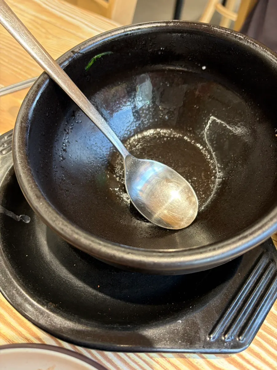 Emptied blood sausage soup bowl, broth and all