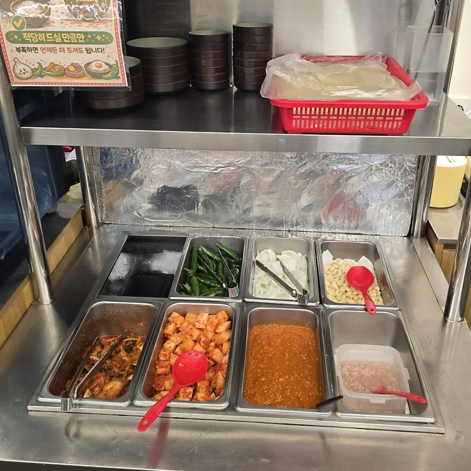 Basic gukbap sides like chives and salted shrimp