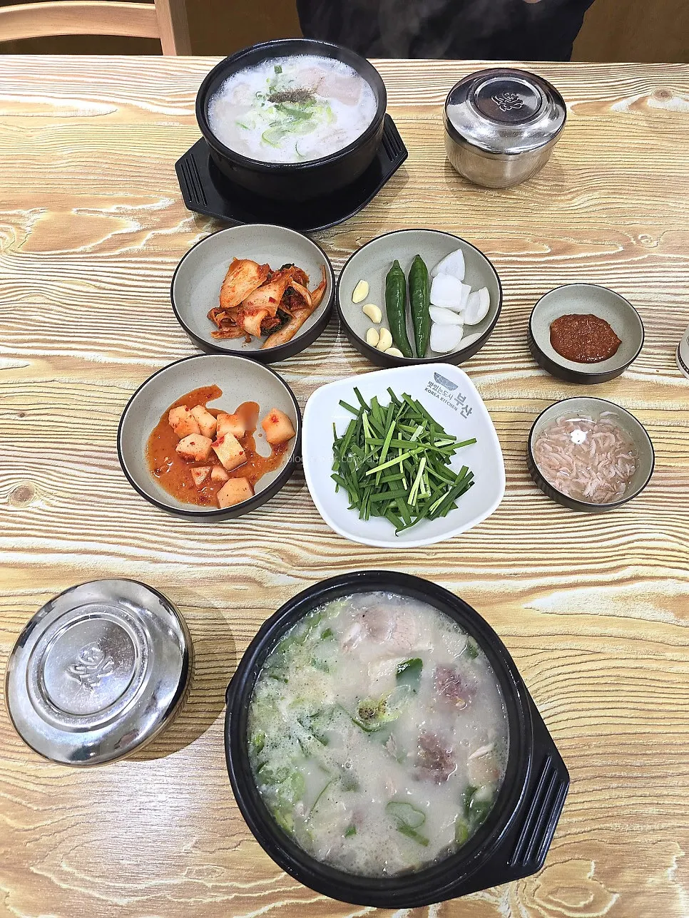 Bubbling stone pots of blood sausage soup and large pork jowl soup
