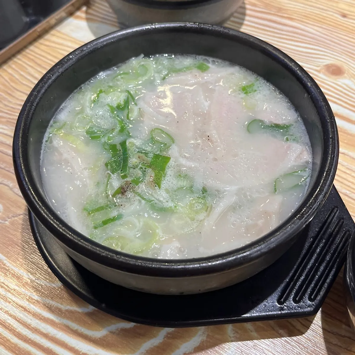 A full spread of pork gukbap at Geumsu Dwaeji Gukbap Gyeongseong-Pukyongdae Branch