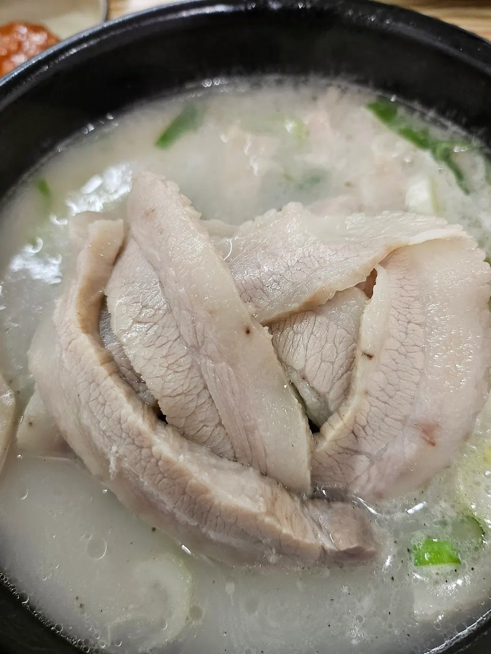 Wrapping up a lettuce wrap with the boiled pork