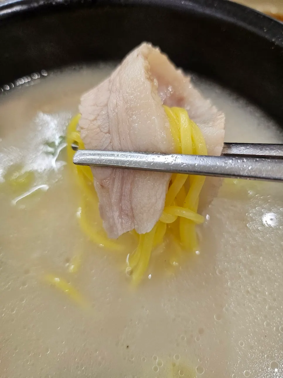 Mixing rice into the pork jowl gukbap