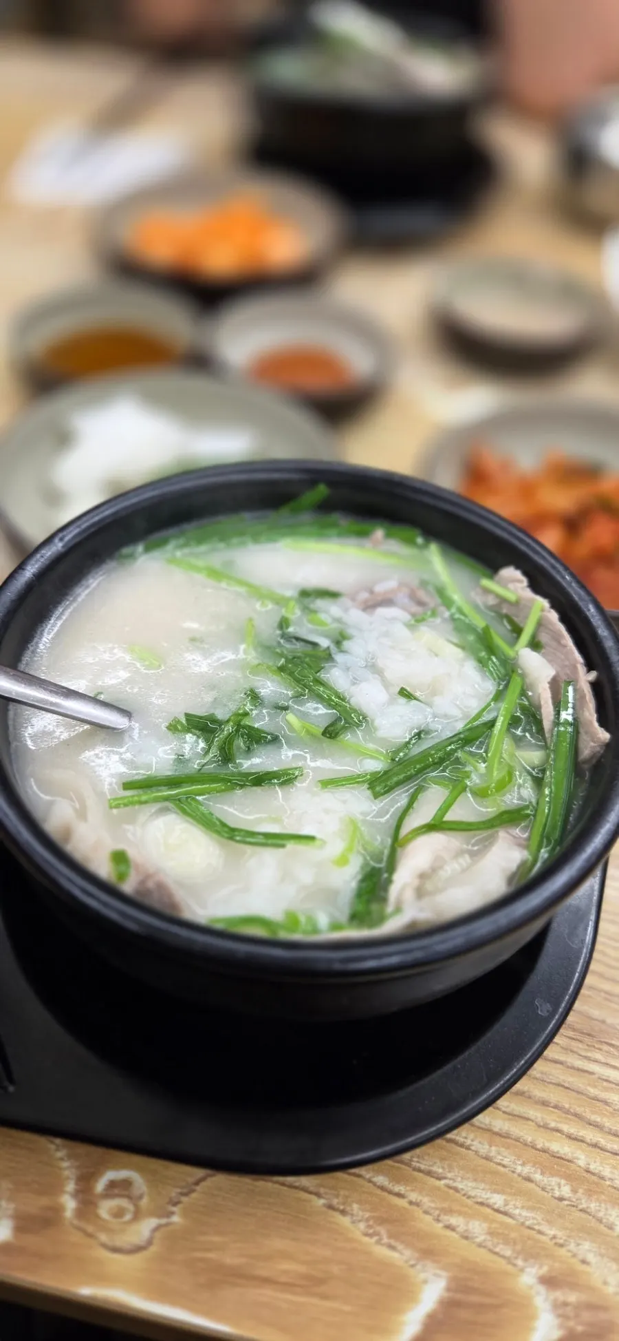 Pork pieces lifted out of the soup