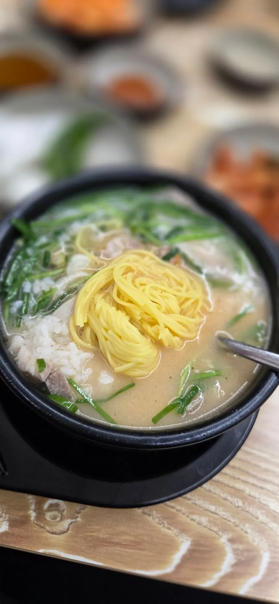 A meal of soup paired with fresh kimchi