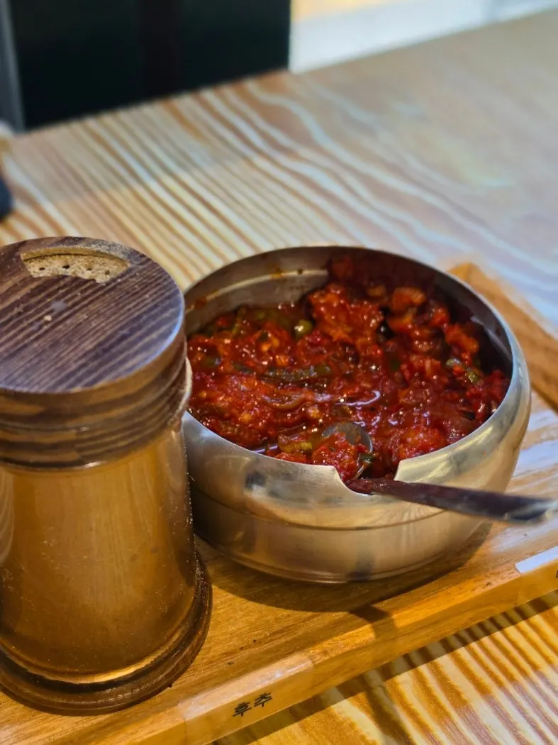 Pepper and dadaegi sauce placed on the table with basic side dishes