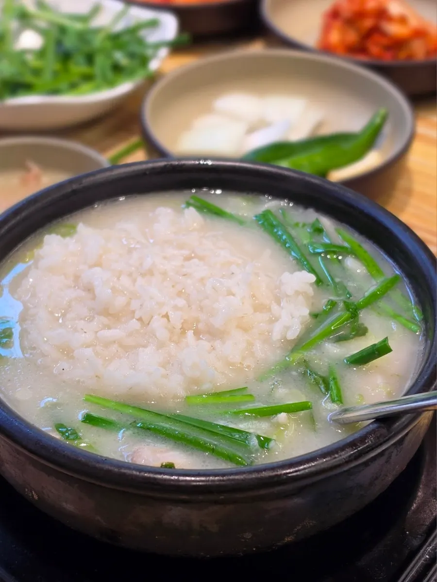 A finished bowl of gukbap with rice mixed in