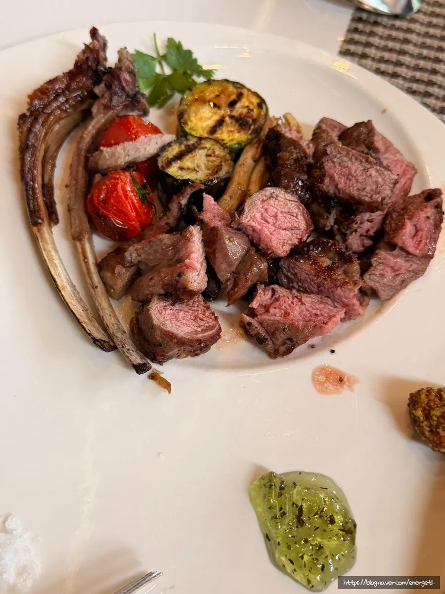 A full spread of pasta, risotto, and lamb chop steak