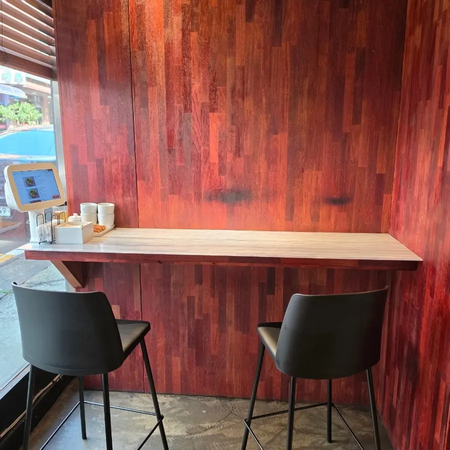 Interior of Geuni Sikdang with wooden tables