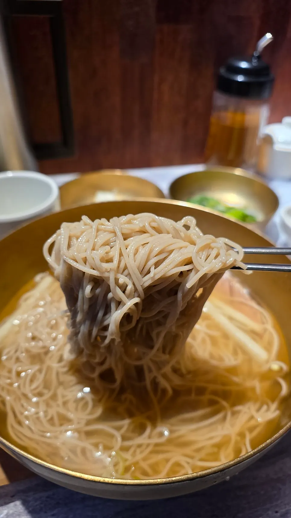 Table set with pyeongyang naengmyeon and king mandu together
