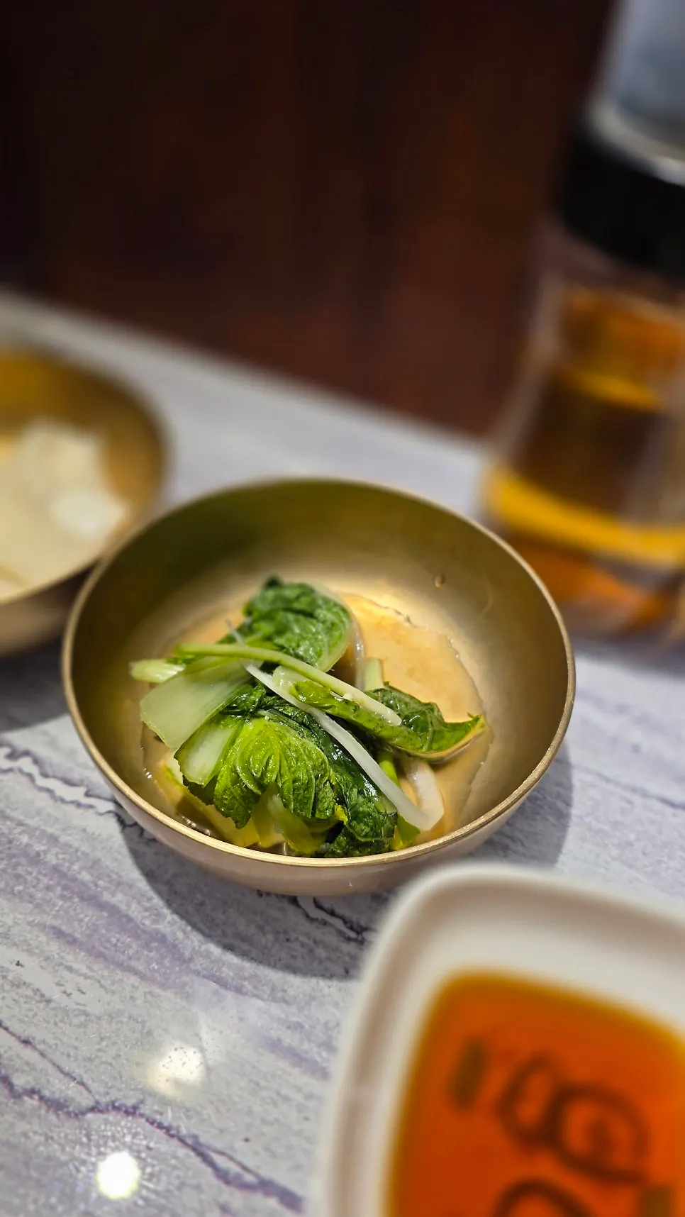 Table photo showing naengmyeon and king mandu together