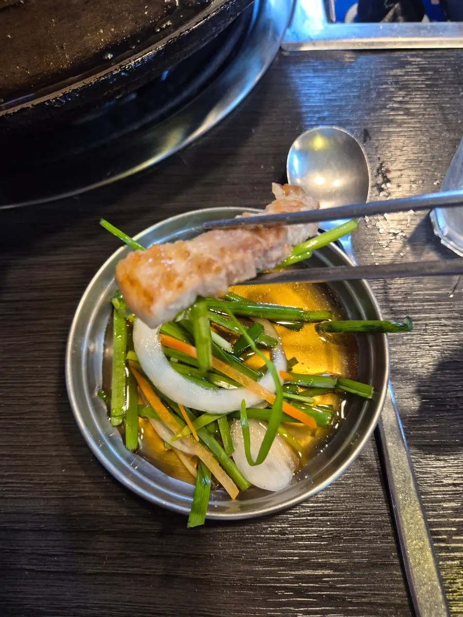 A golden-brown grilled piece of pork belly