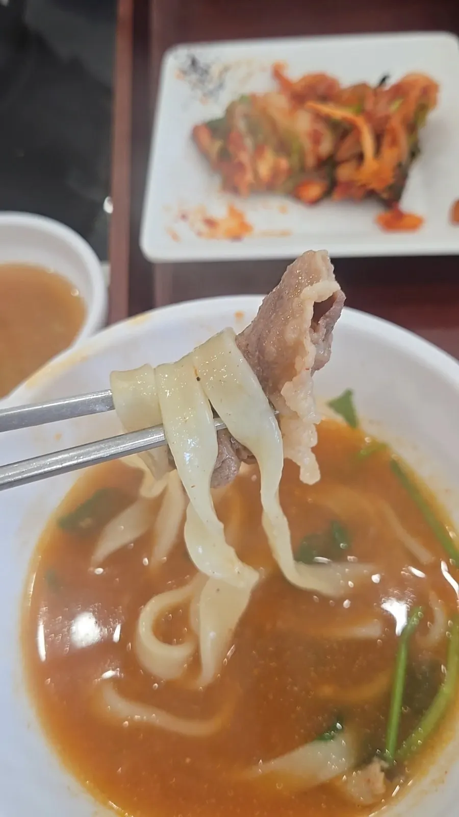 Live abalone shabu-shabu being cooked