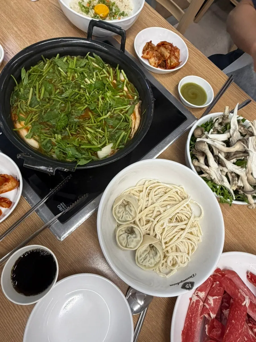 Table set with shabu-shabu ingredients