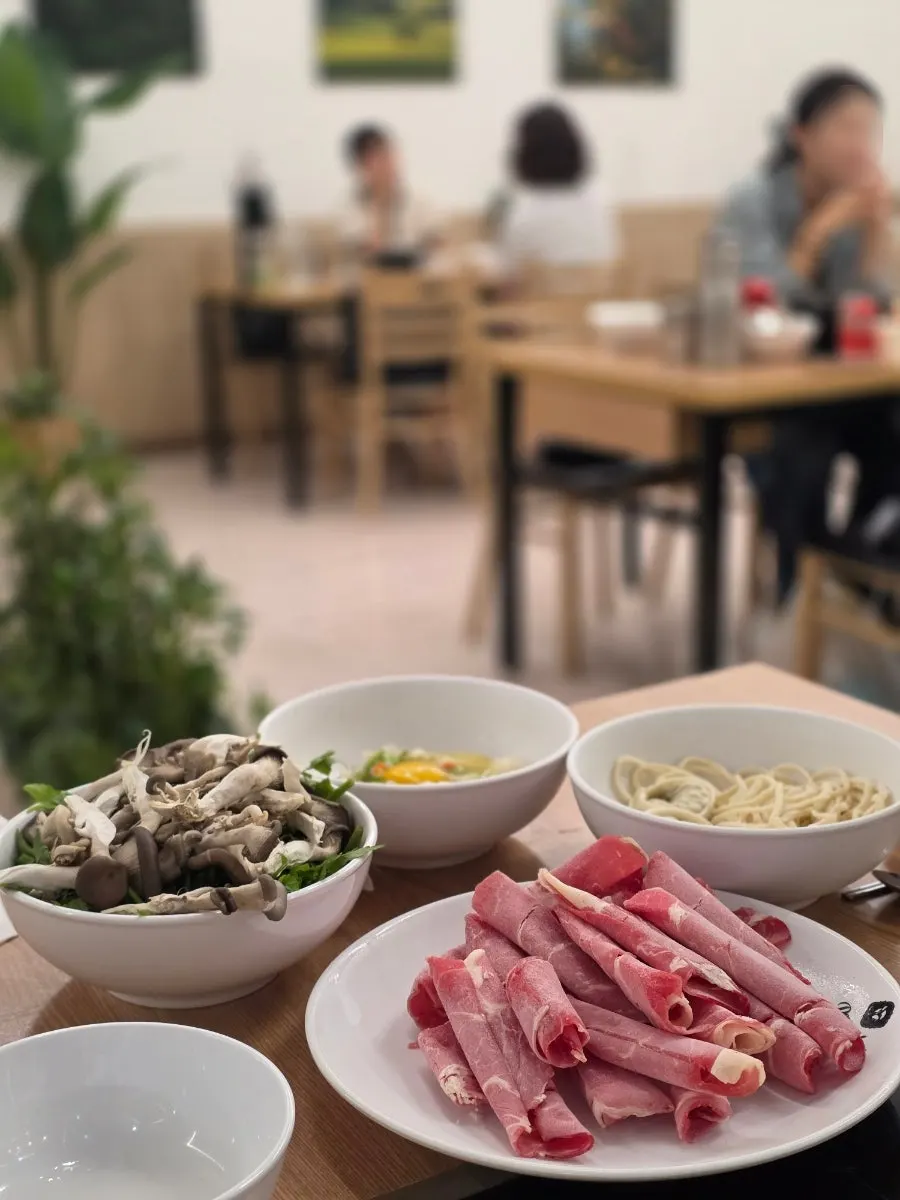 Shabu-shabu table setting at Deungchon Shabu Kalguksu Giheung Station Branch