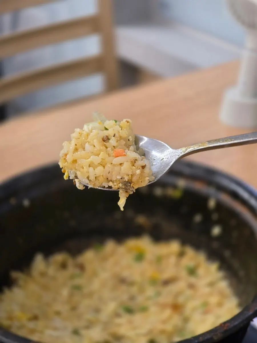 A spoonful of fried rice with a scorched-rice-like crunch
