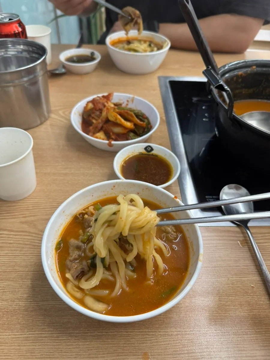 Kalguksu noodles boiling in added broth