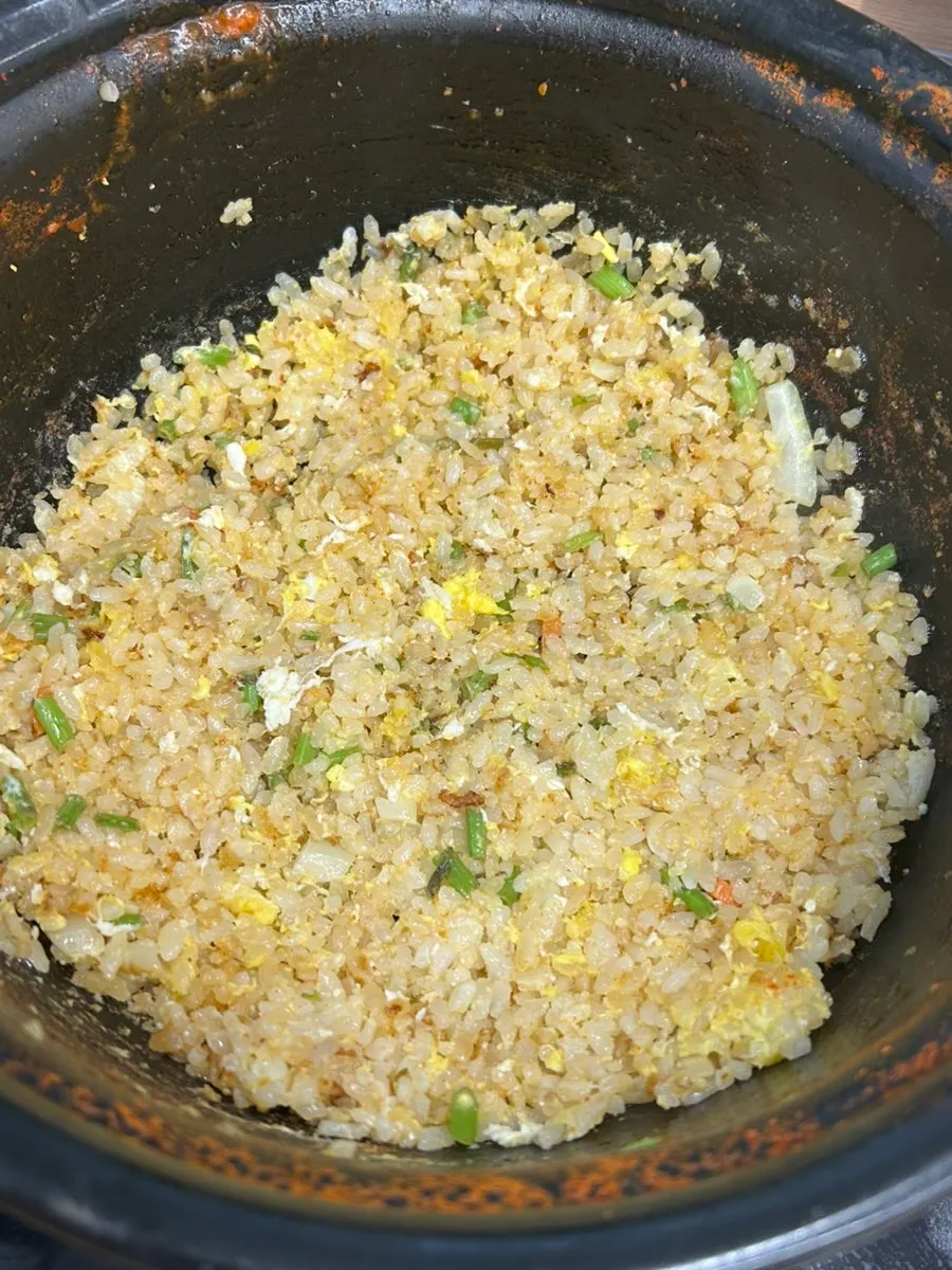 Fried rice topped with egg yolk