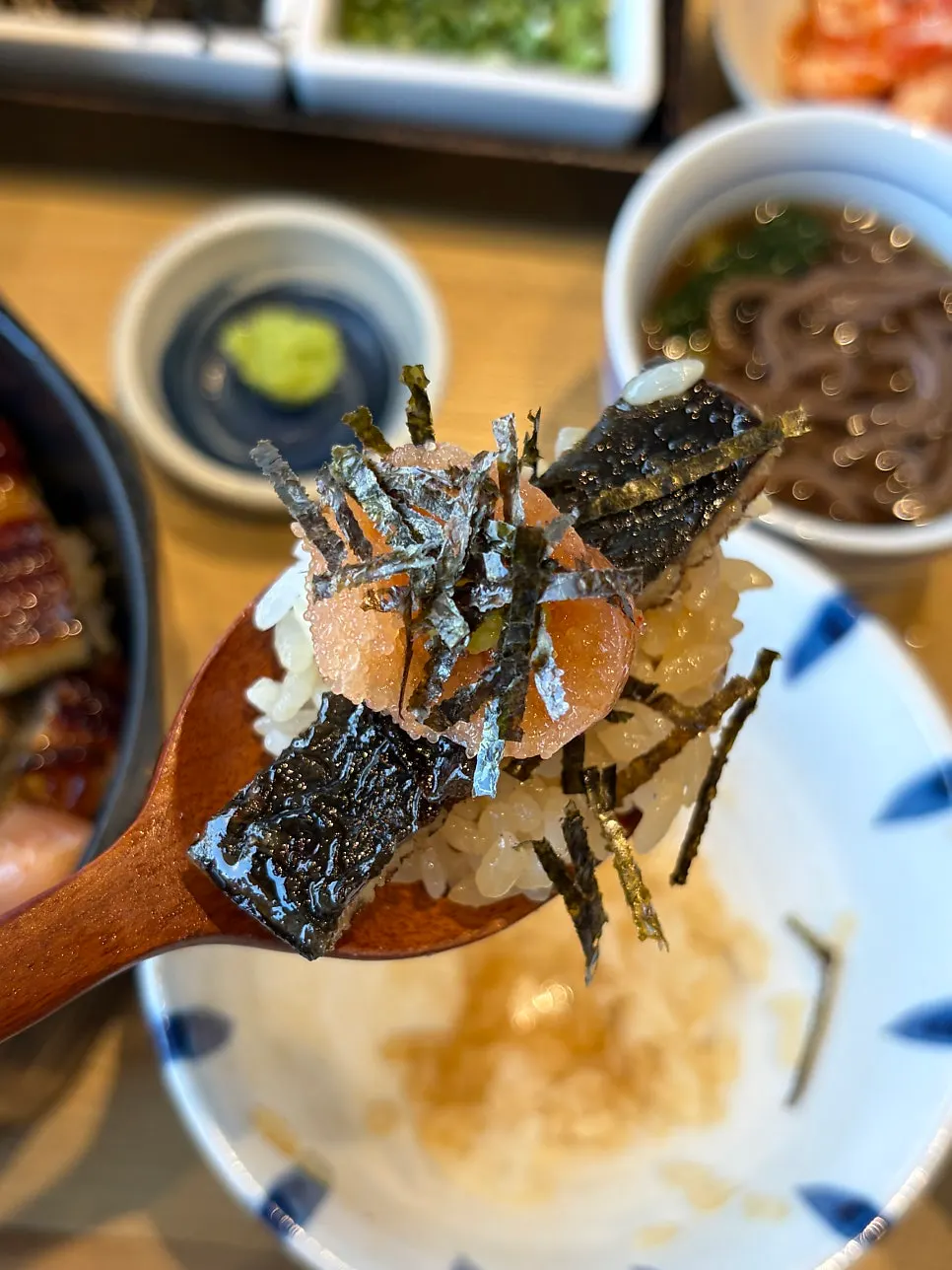 Hitsumabushi topped with nori flakes, scallion, and fresh wasabi