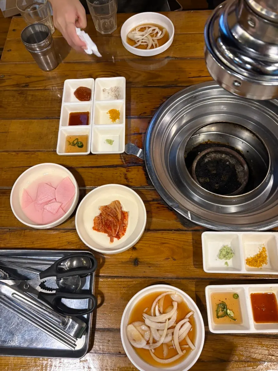 Table of side dishes including bean sprout soup