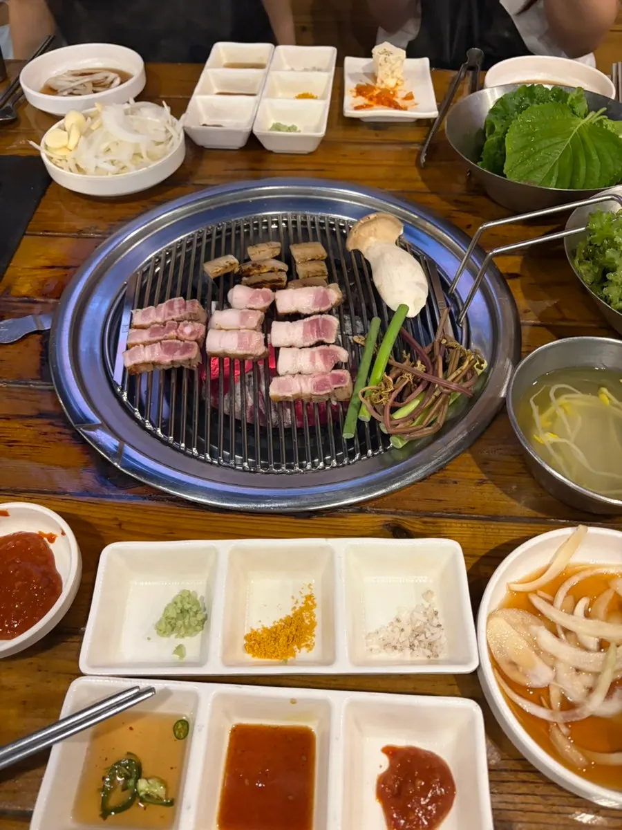 Pre-grilled pork belly on the grill