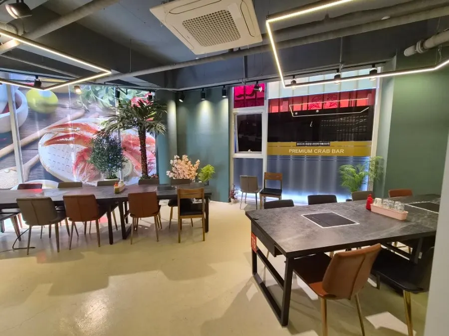 Second-floor dining hall decorated with lights and plants
