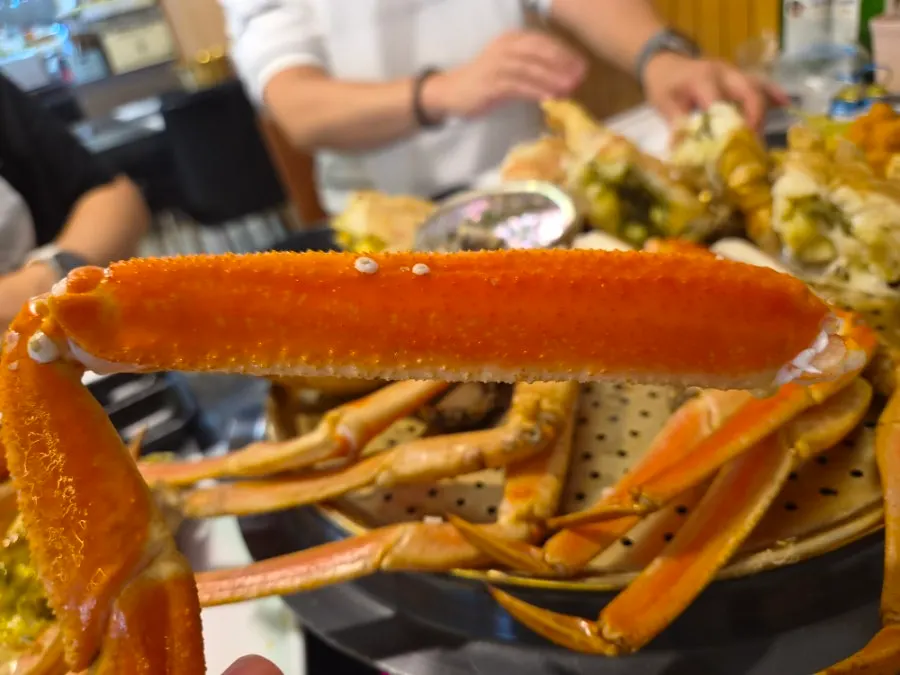 Table setting with meaty snow crab legs