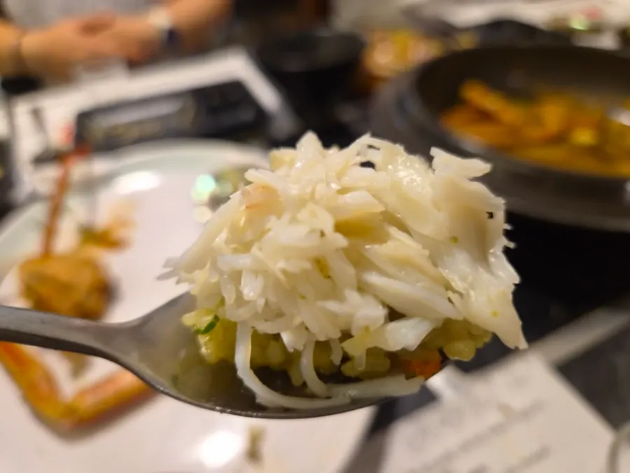 Crab-shell fried rice topped with snow crab meat