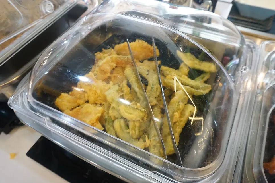 Boneless fried chicken and fritters on the salad bar