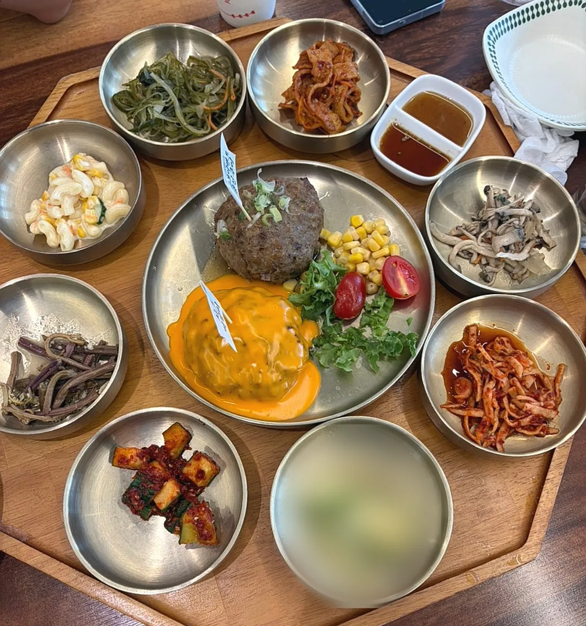 Table set with the cheese tteokgalbi set and Dongam tteokgalbi set