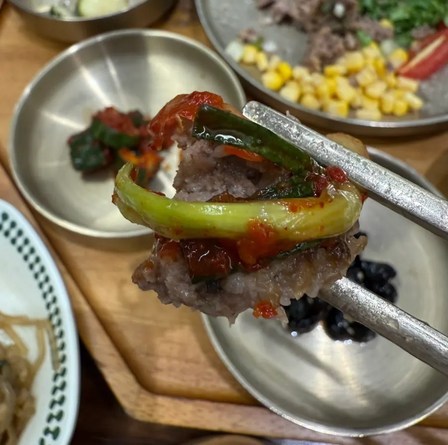 Cross-section of tteokgalbi cut with a spoon