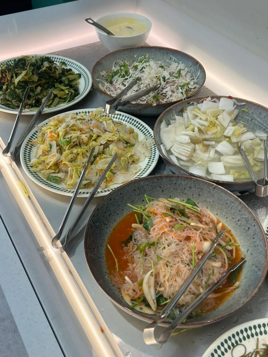 An assortment of side dishes from the Dongam Tteokgalbi self-bar