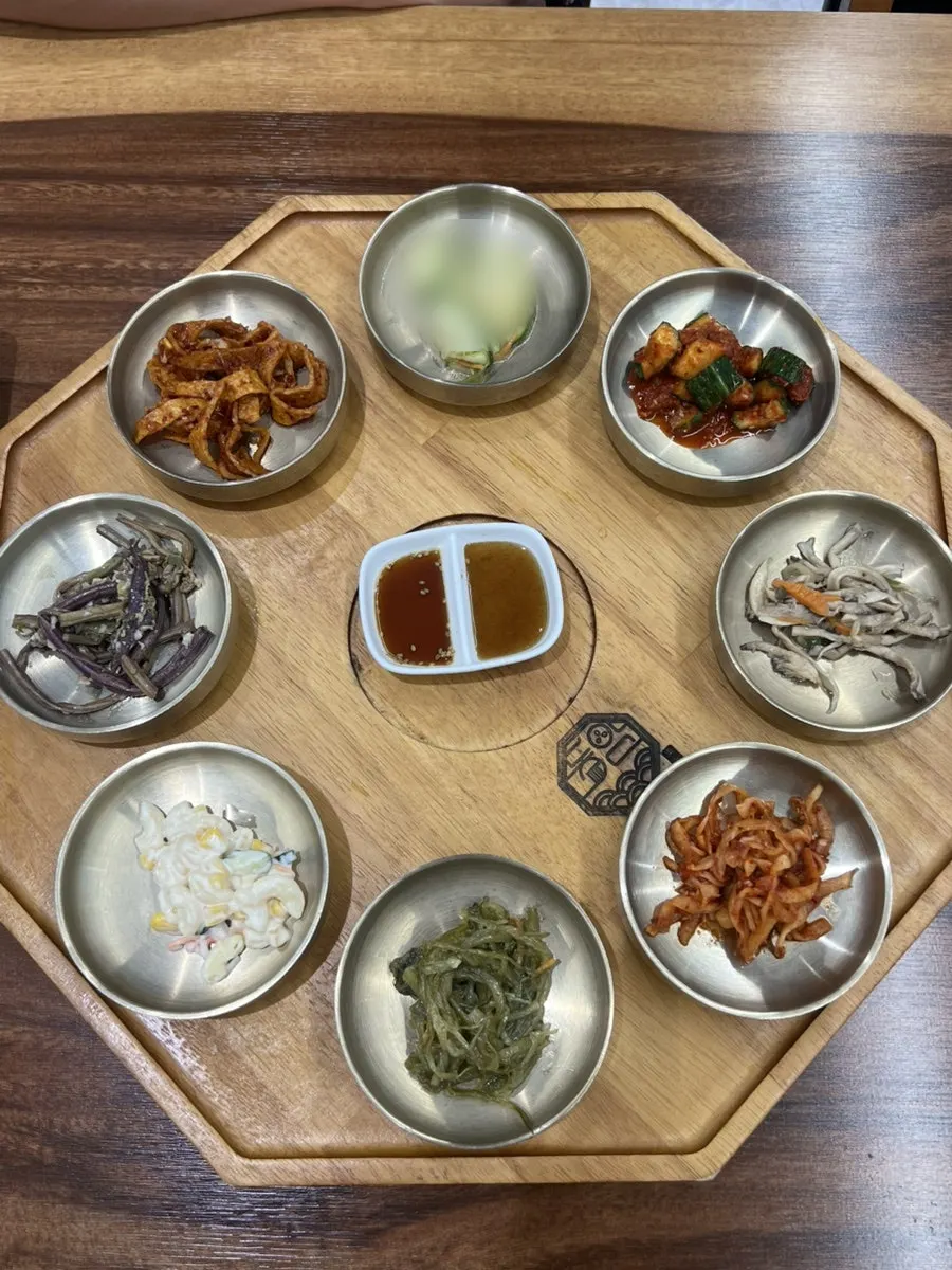 Full tteokgalbi spread packed with side dishes and soup